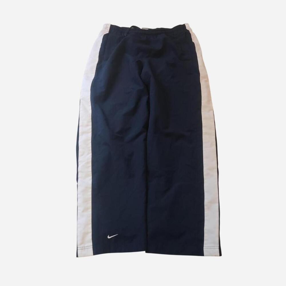 Vintage Nike navy blue baggy track pants with white side stripes